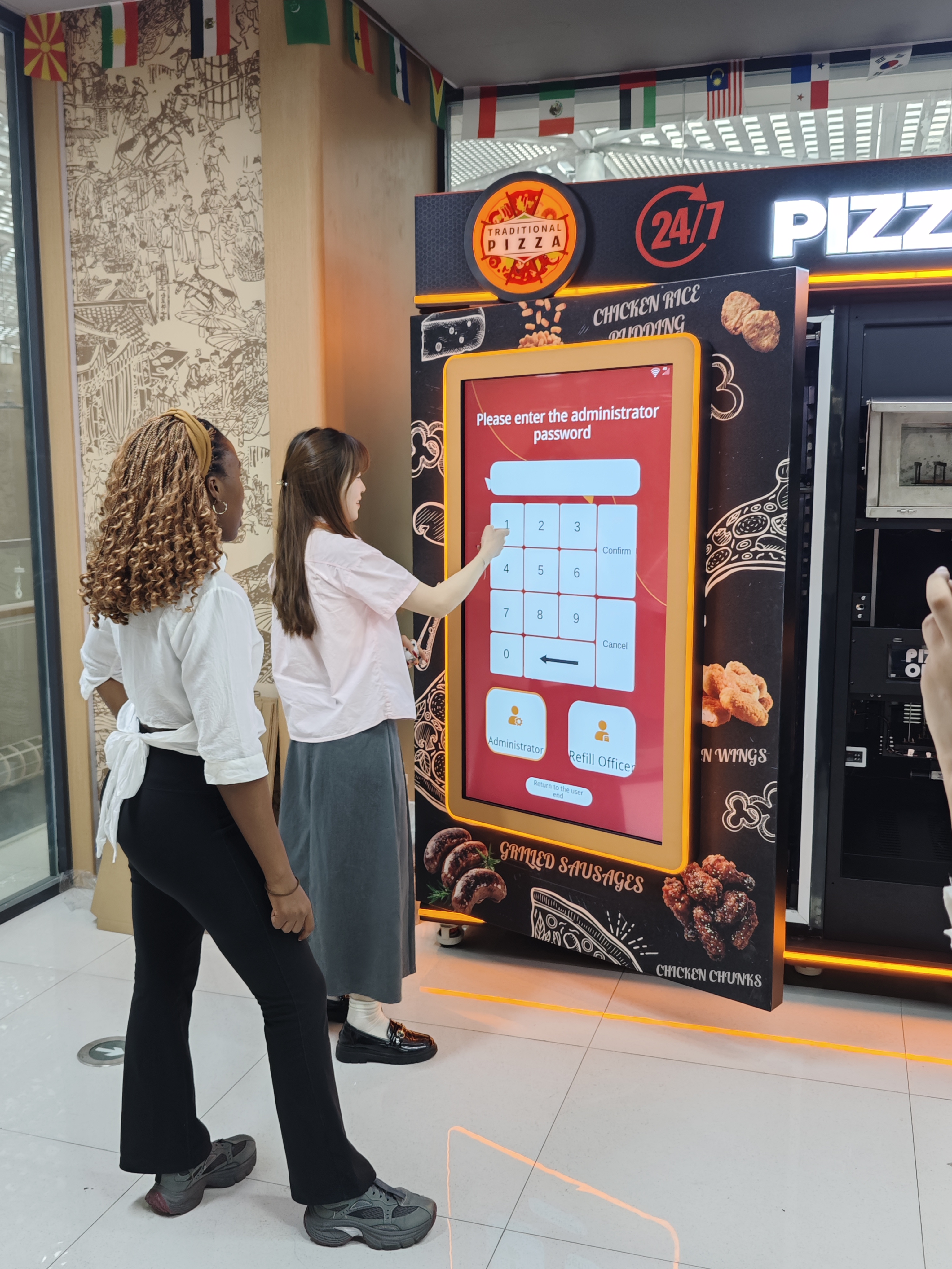 Overseas customer observing a touchscreen vending machine demonstration